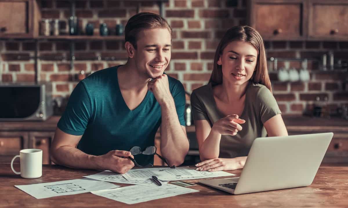 couple discussing when to replace home siding